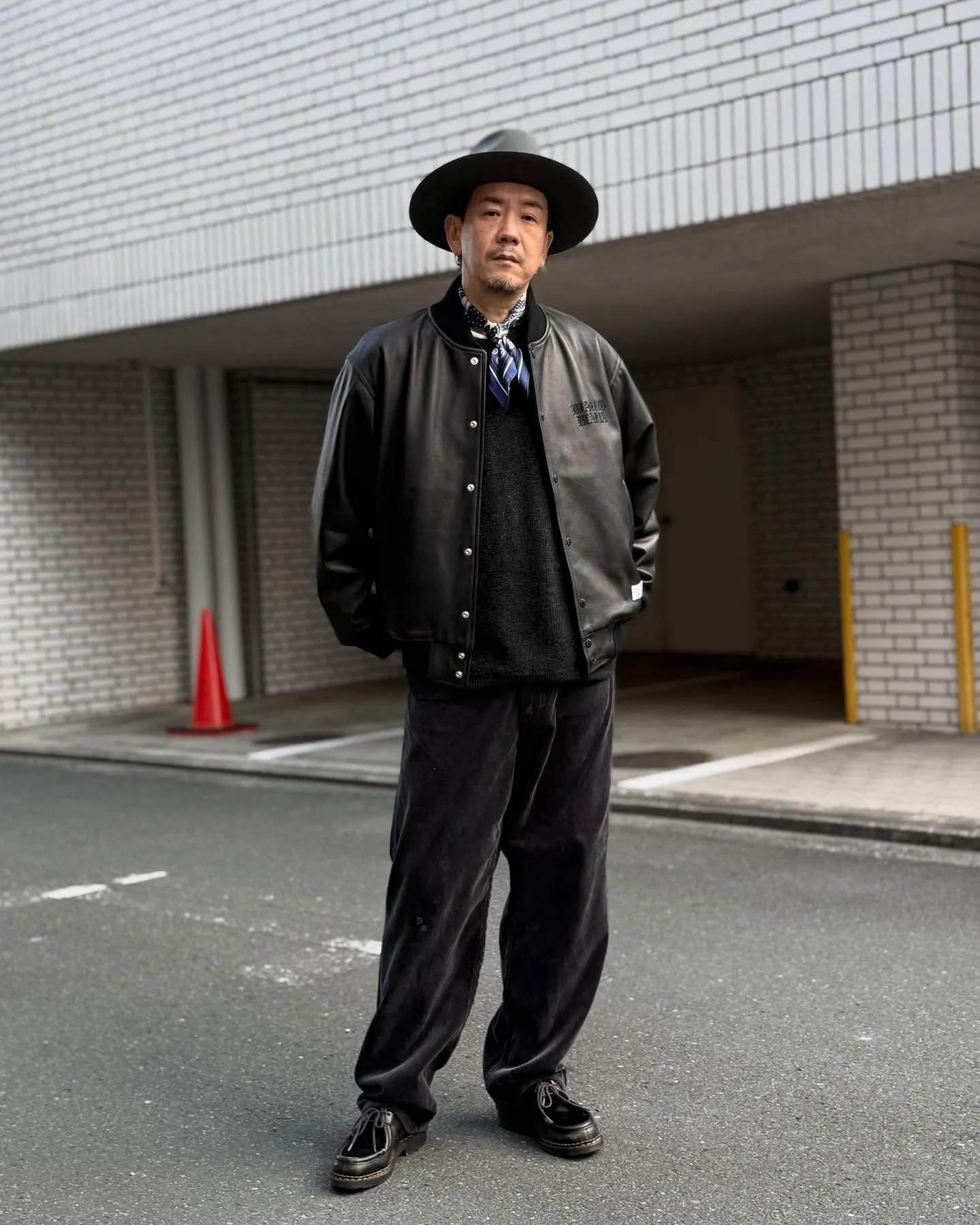 WACKO MARIAのレザーのバーシティジャケット。